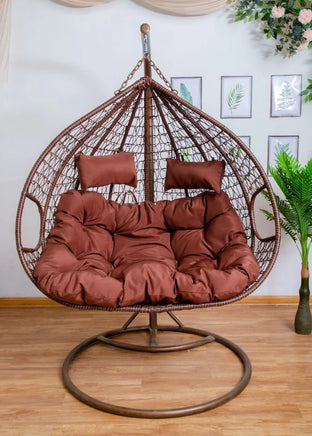 double-hanging-egg-chairs-brown-basket-and-light-brown-cushion