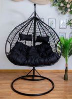 double-hanging-egg-chairs-black-basket-and-black-cushion