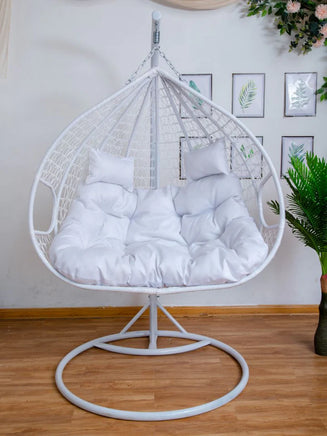 double-hanging-egg-chairs-white-basket-and-white-cushion