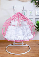 double-hanging-egg-chairs-pink-basket-and-white-cushion